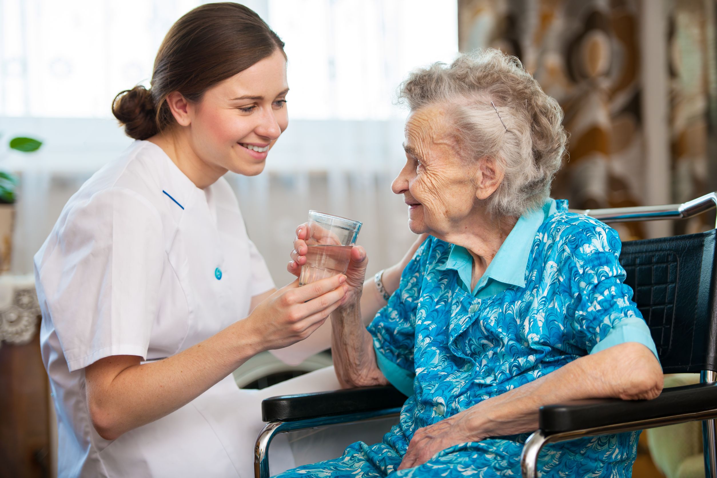 14298411 - senior woman with her caregiver at home